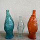 3 glass bottle fish
