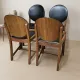 Set of four vintage wooden dining chairs with black leather upholstery, 85 × 45 × 45 cm