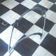 coffee table with metal legs and smoked glass top