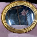 Golden oval mirror