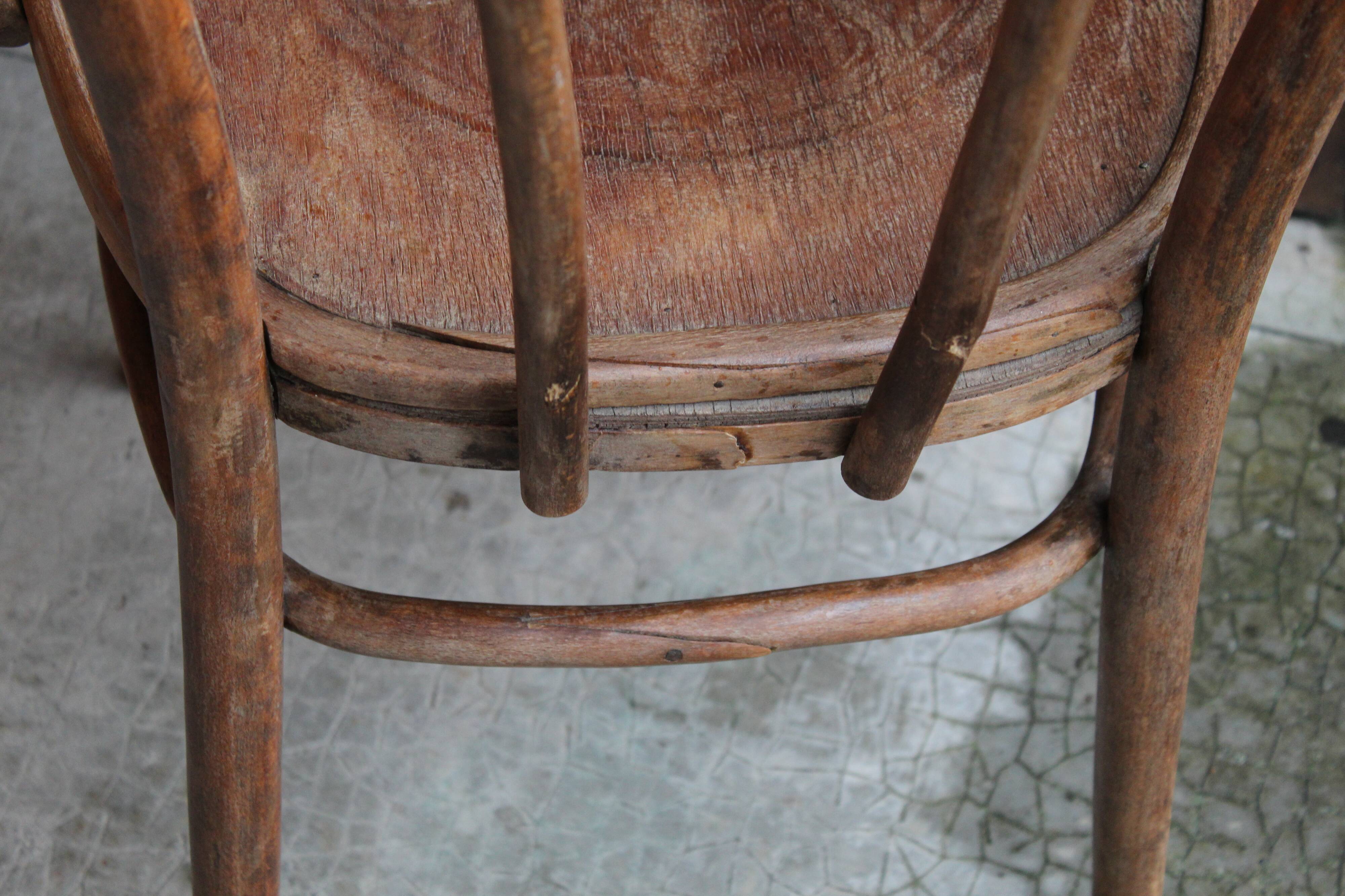 Curved wooden armchair