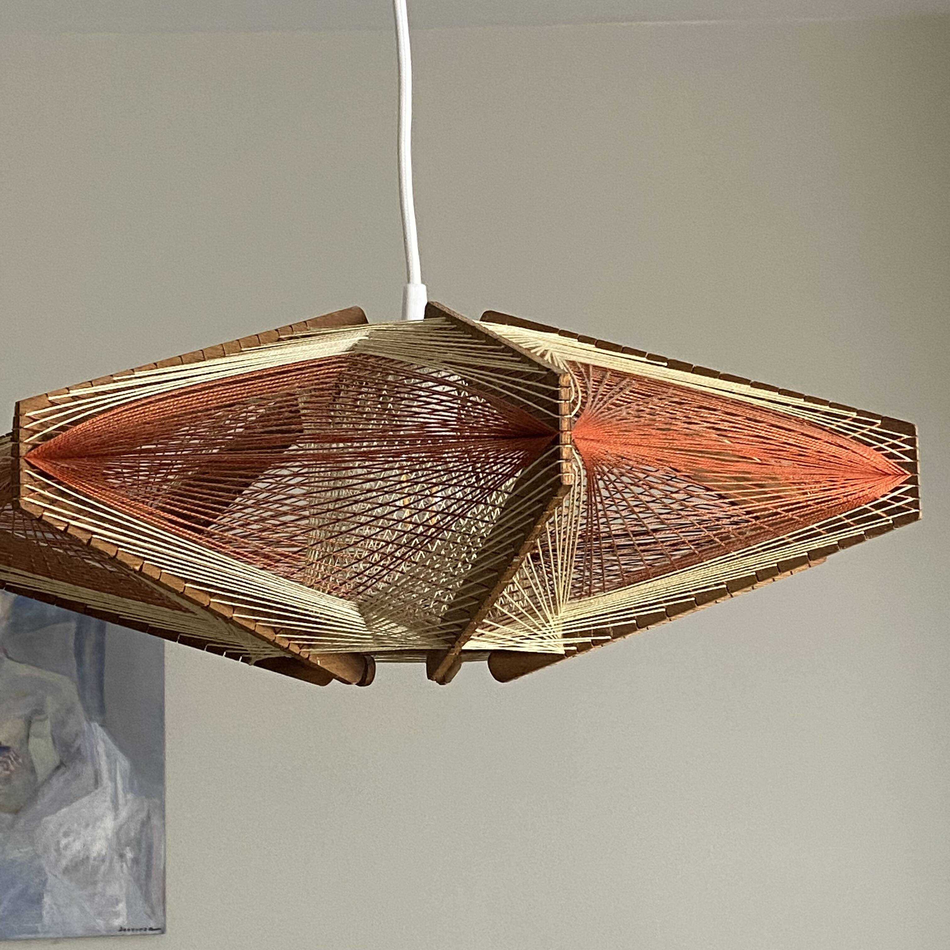 Vintage Scandinavian pendant light with stretched wires.