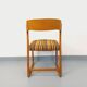 Vintage sled chair by Baumann in wood and wool fabric.