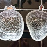 Two molded glass cups in the shape of strawberry and pineapple
