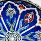 Decorative plate in glazed ceramic