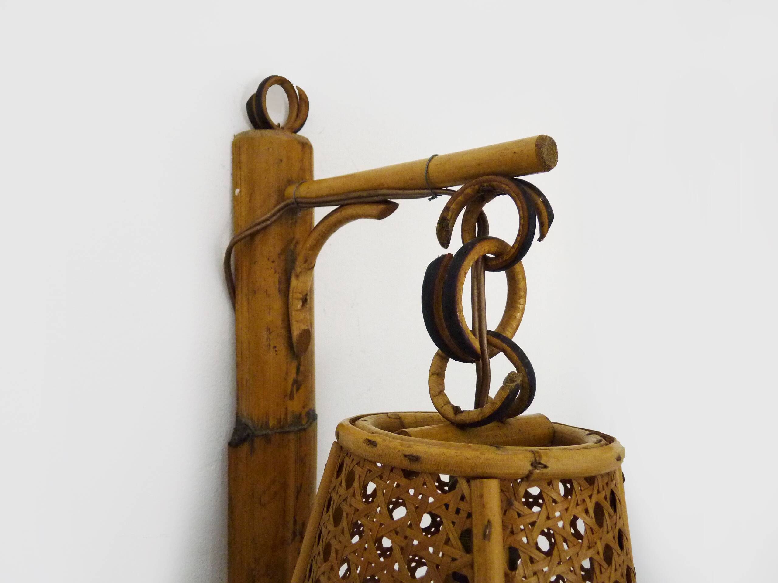 Pair of rattan and cane lantern wall lights. 1950s-60s