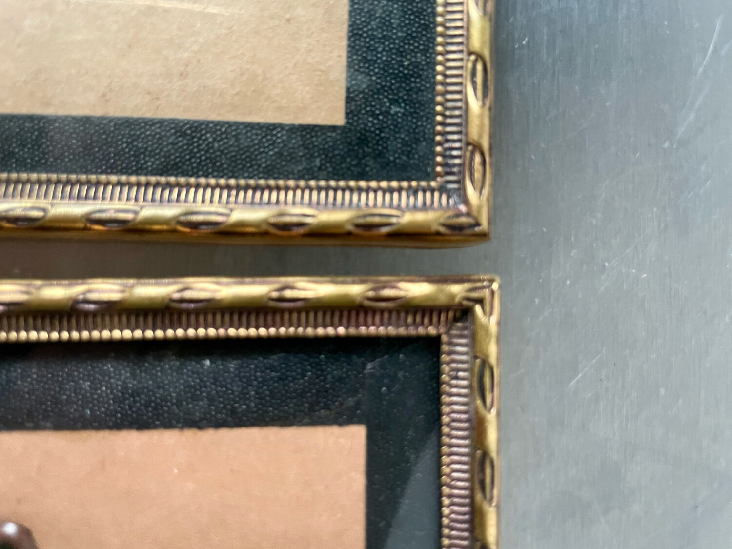 Pair of identical gold colored metal frames each measures  14.5 cm x 9 cm convex glass