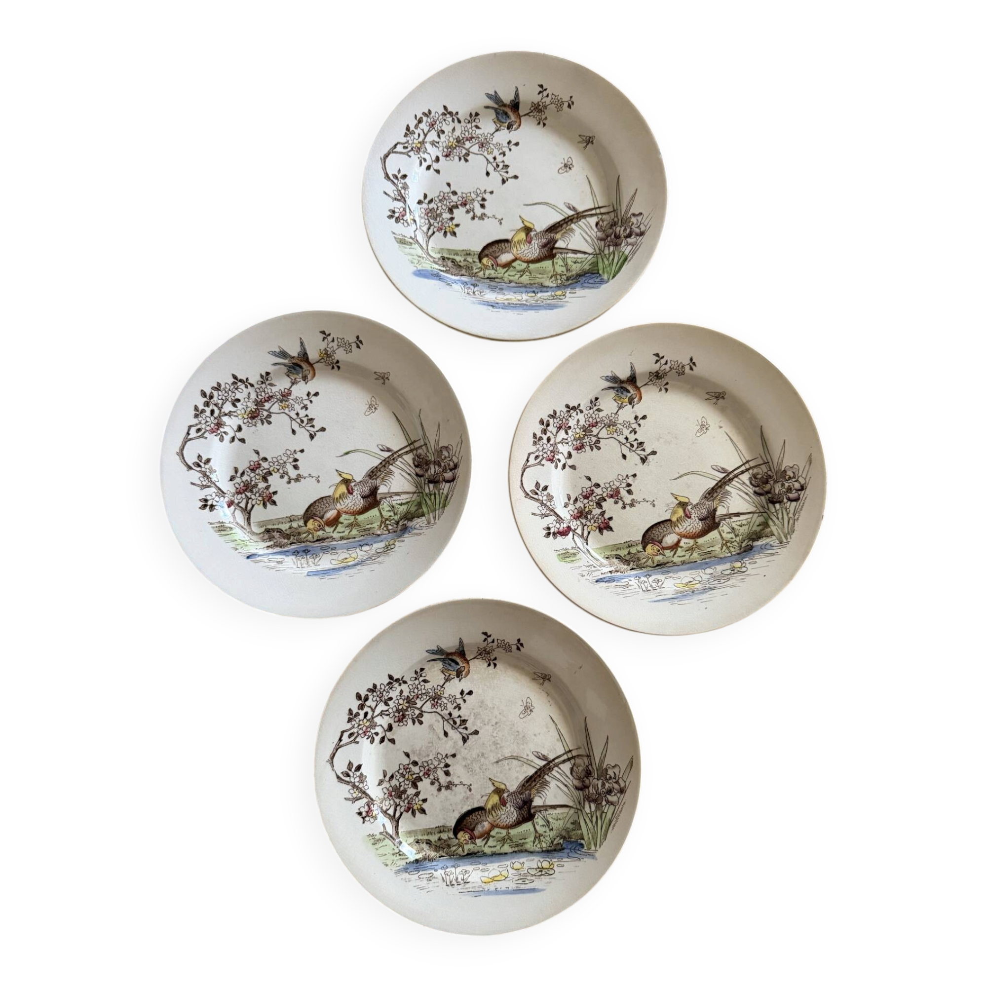 Polychrome ironstone dessert plates from Digoin and Sarreguemines.