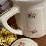 Old teapot or coffee maker in English style.