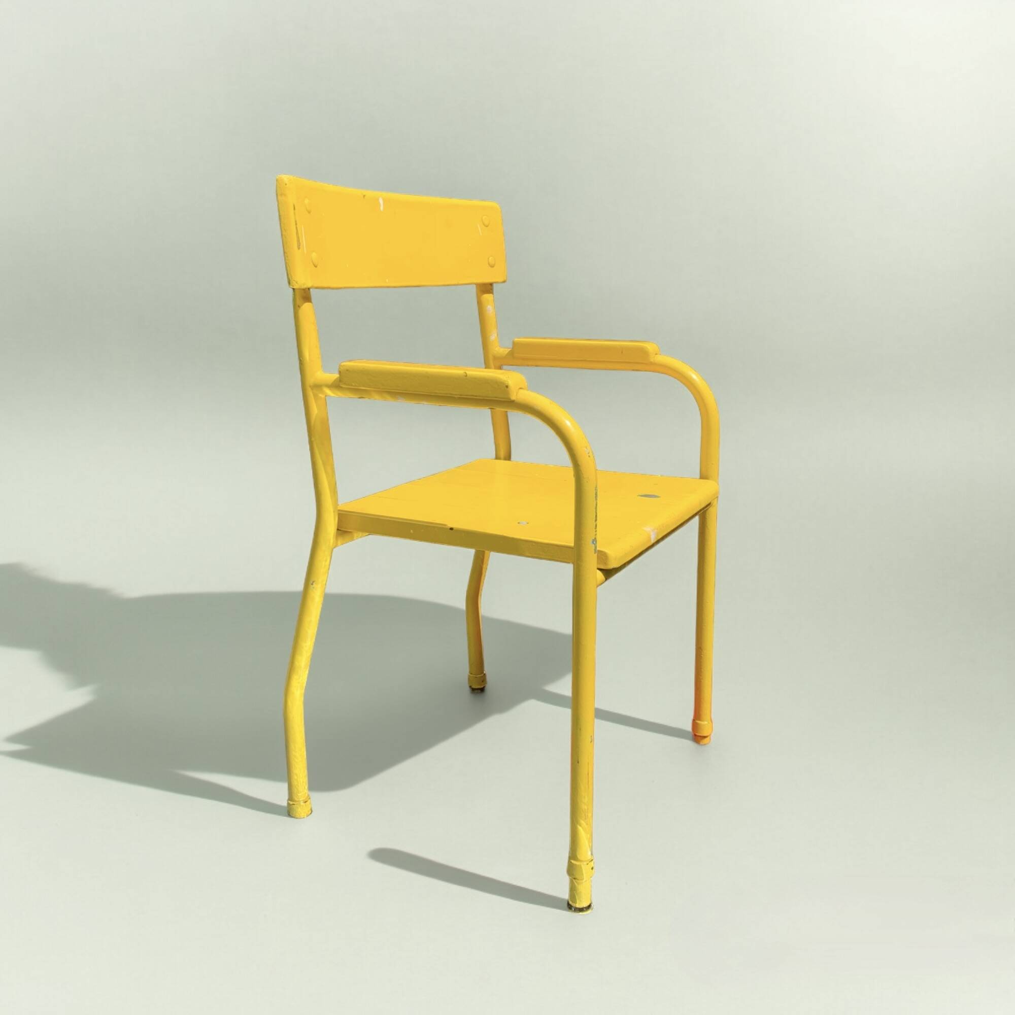 Vintage children's chair in yellow painted wood and metal