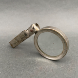 Foldable magnifying glass in silver metal 1900