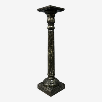 Dark marbled wooden column or pillar