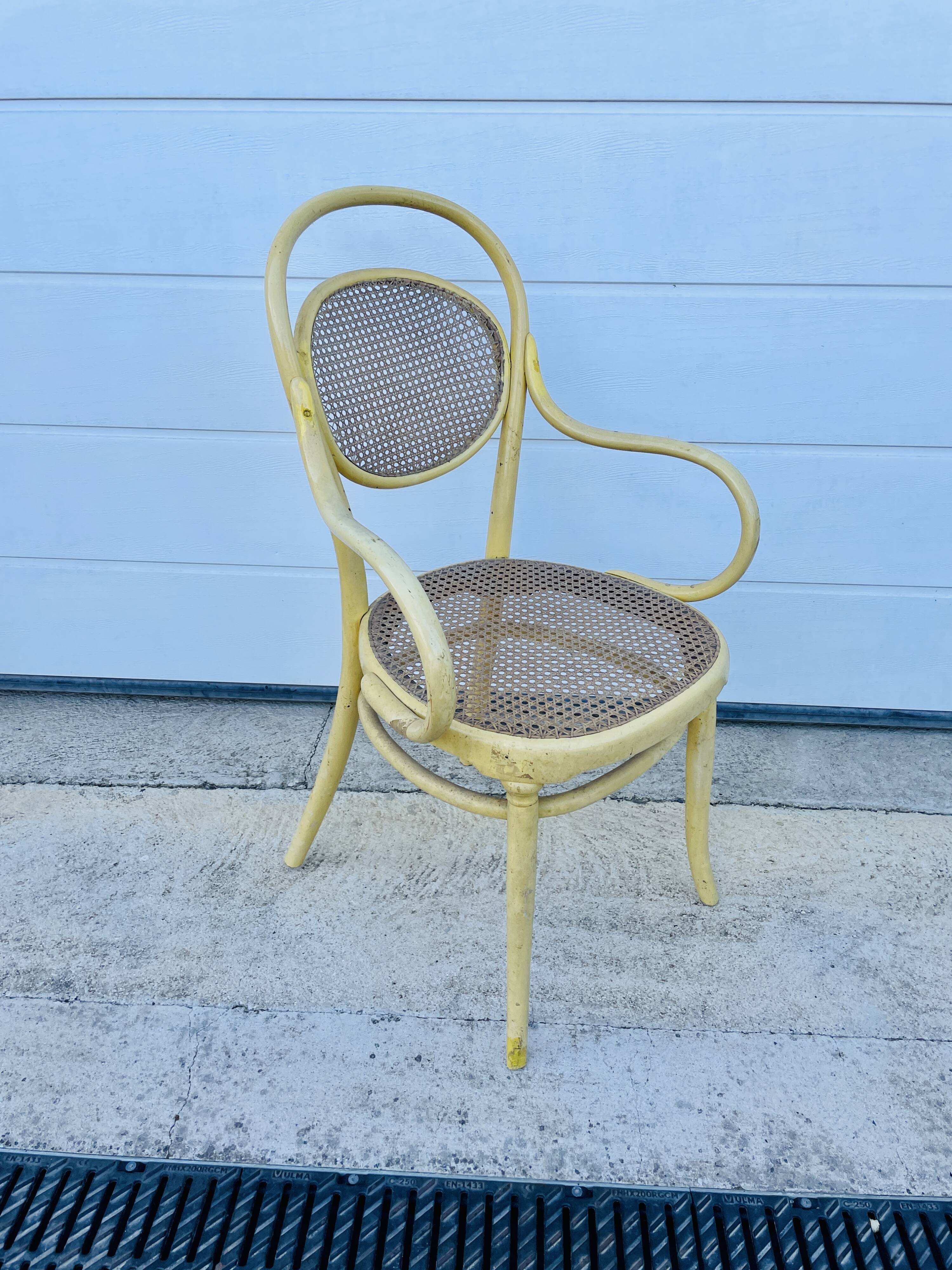 Old armchair Thonet canned wood