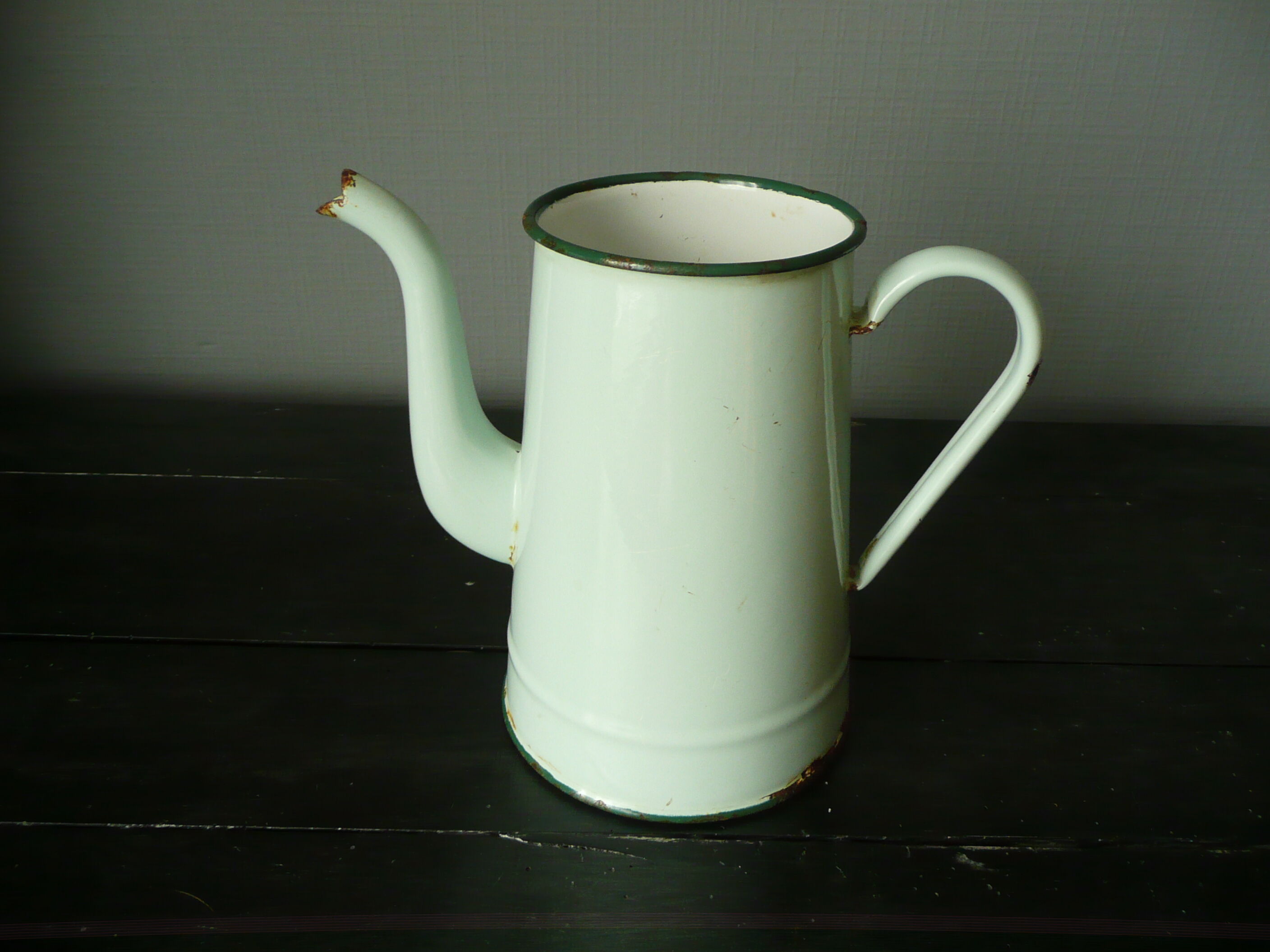 Antique enamelled pitcher