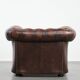 Brown Chesterfield armchair made of cowhide leather in English style