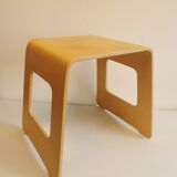 Design stool/side table made of curved plywood.