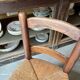 Provençal chair in dark wood and woven straw.
