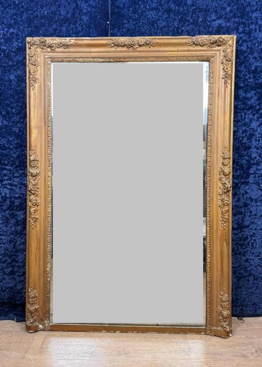 Empire period mirror in wood and gilded stucco circa 1810-1820
