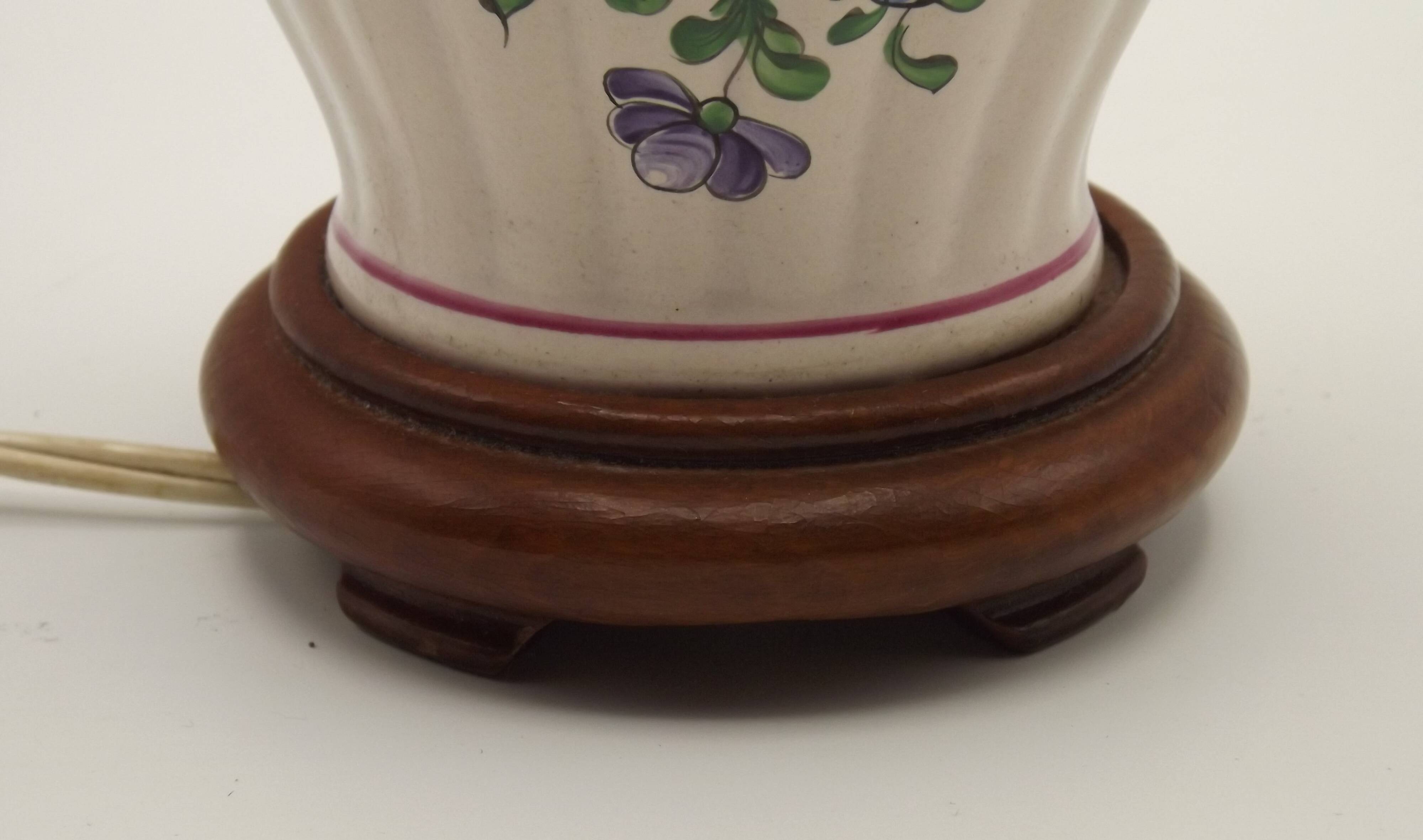 Pretty French vintage hand-painted ceramic floral lamp base on wooden plinth.
