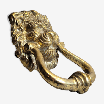 Gilded bronze door knocker in the shape of a lion's head