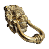 Gilded bronze door knocker in the shape of a lion's head
