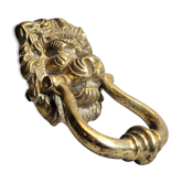 Gilded bronze door knocker in the shape of a lion's head