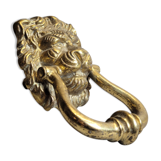 Gilded bronze door knocker in the shape of a lion's head