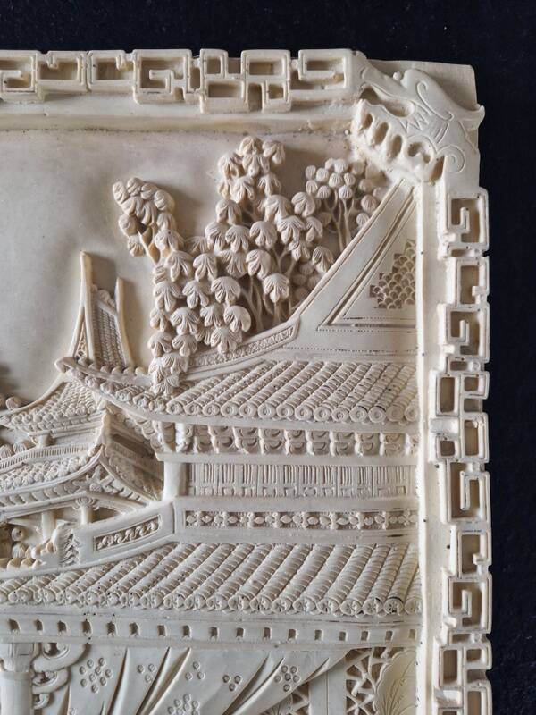 Sculpted resin plaque in the style of China.
