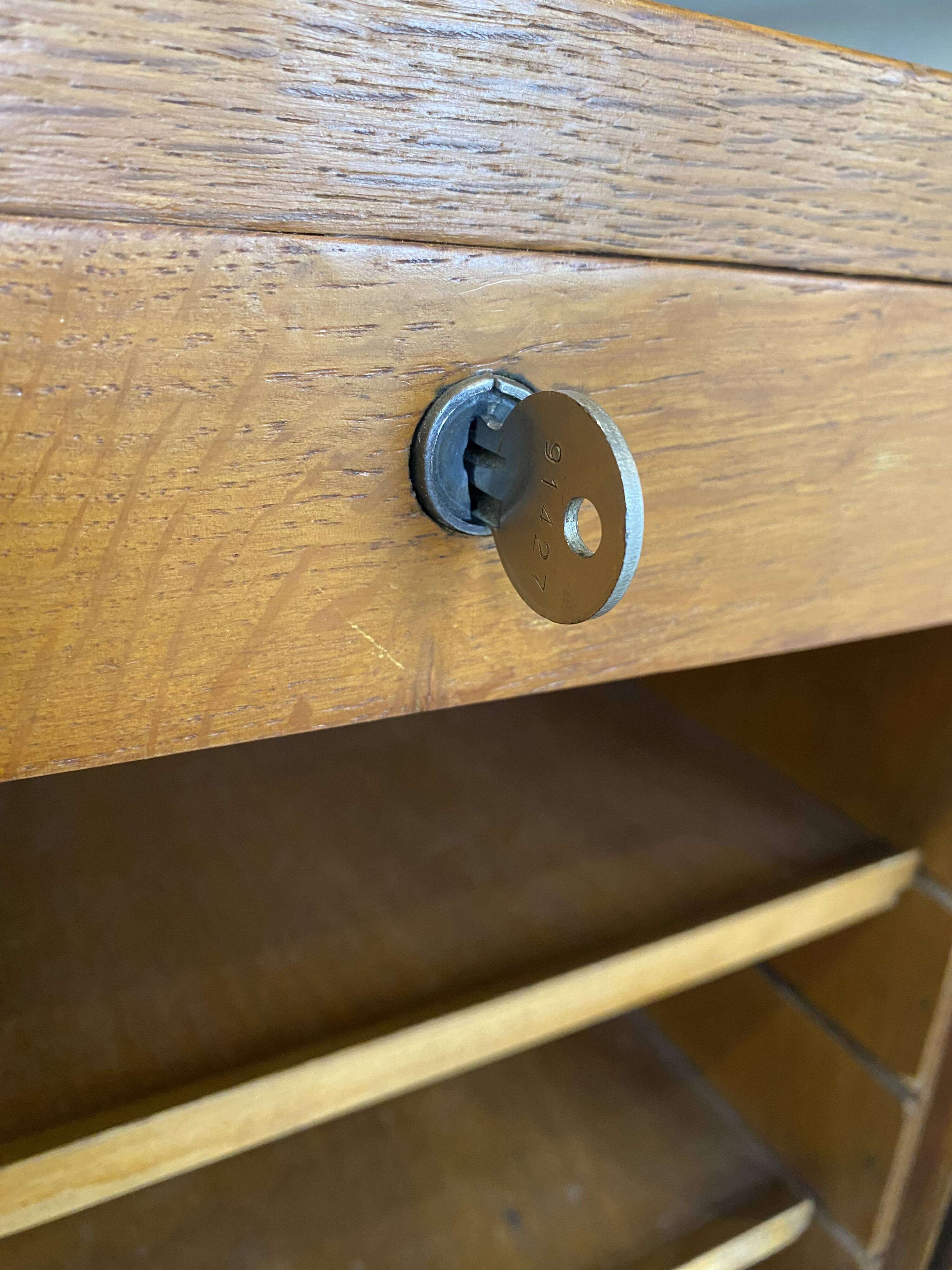 1950s oak office storage cabinet with curtains.