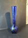 Vintage cobalt blue glass vase with foliage decoration.