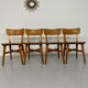 Set of 4 vintage solid oak chairs, 1960s design with sculpted backrest.