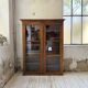 Glass-fronted walnut library 1900