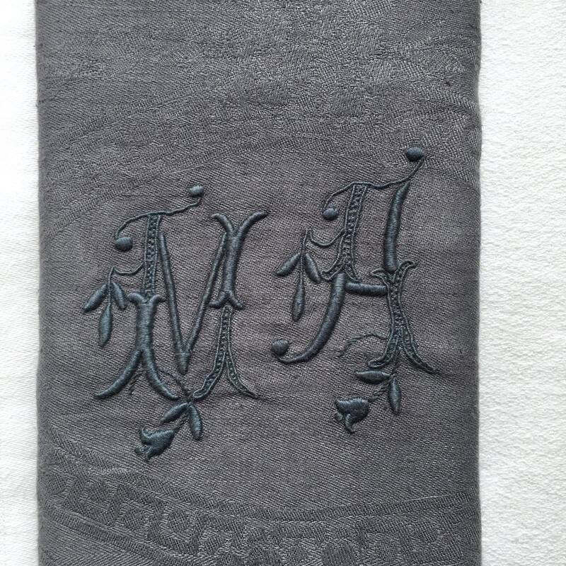 Old embroidered table napkin MA dark grey