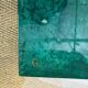 Aldo Tura side table in aqua green with brass legs and lower drawer.