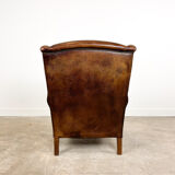 Vintage dark brown sheep leather wingback armchair