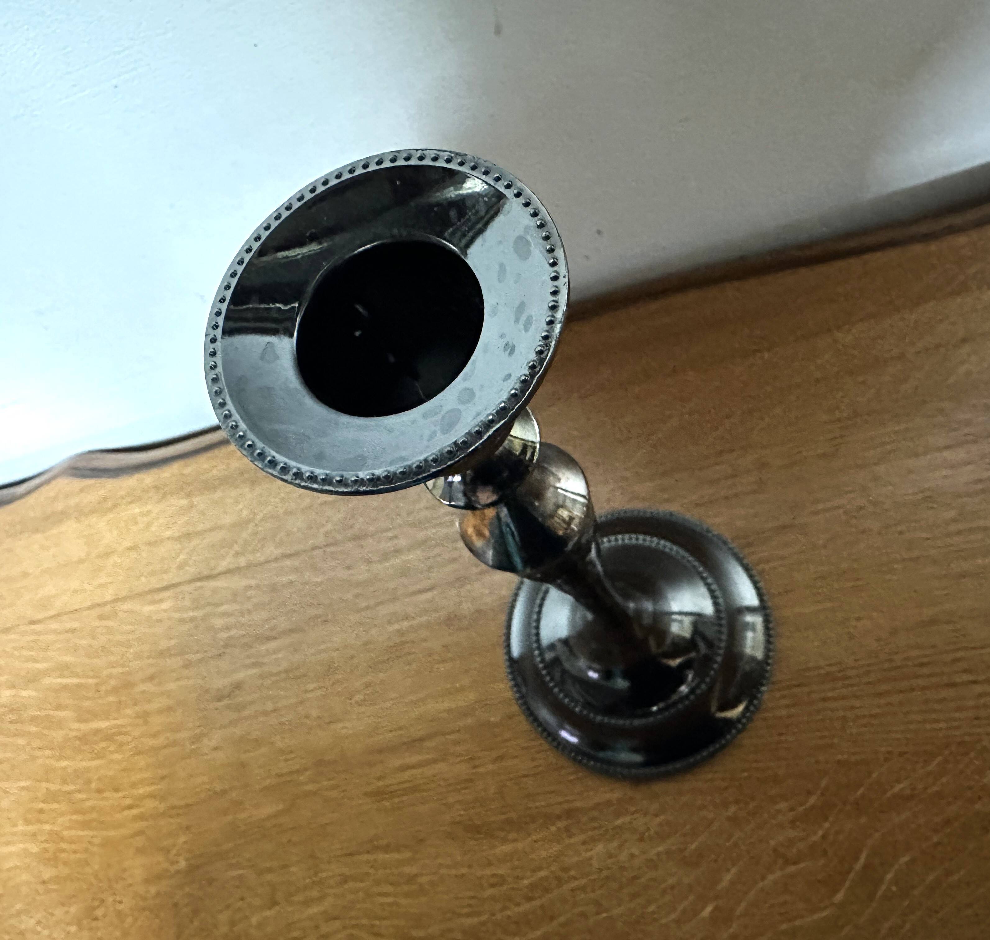 Varnished black metal candlestick