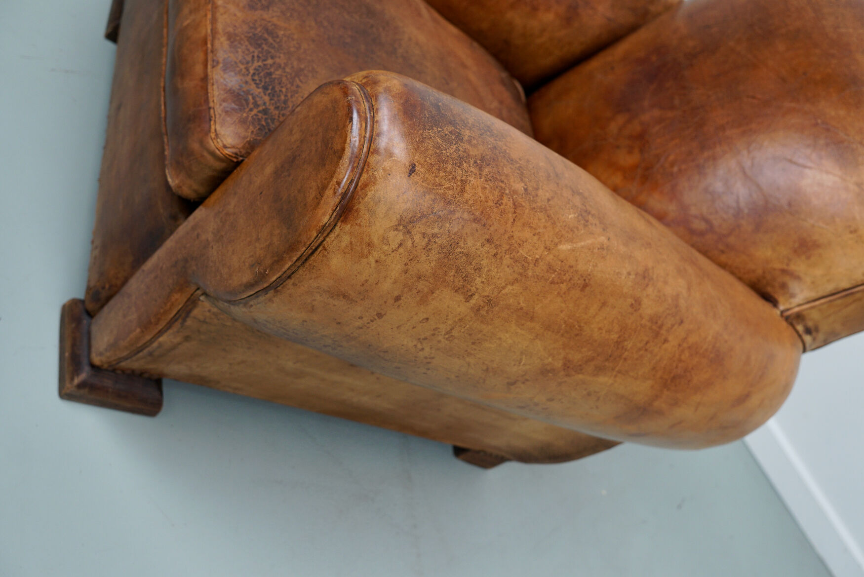 French moustache back cognac-colored leather club chair, 1940s