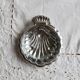 Vintage shell-shaped shiny silver-plated catchall.
