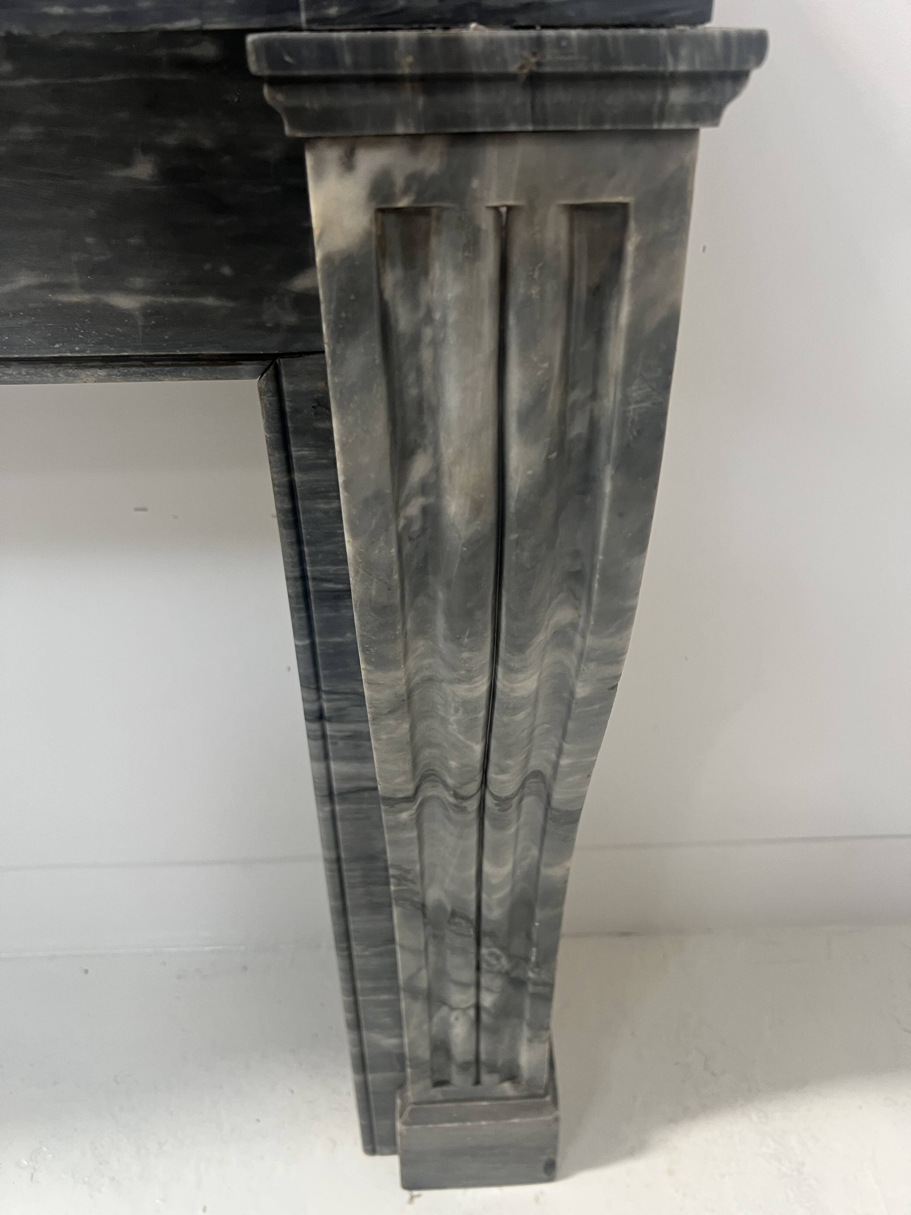 Napoleon III fireplace in blue Turquin marble from the 19th century.