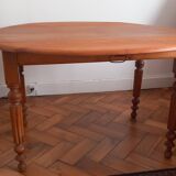 Round table with folding sides
