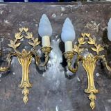 Pair of double sconces in gilded bronze