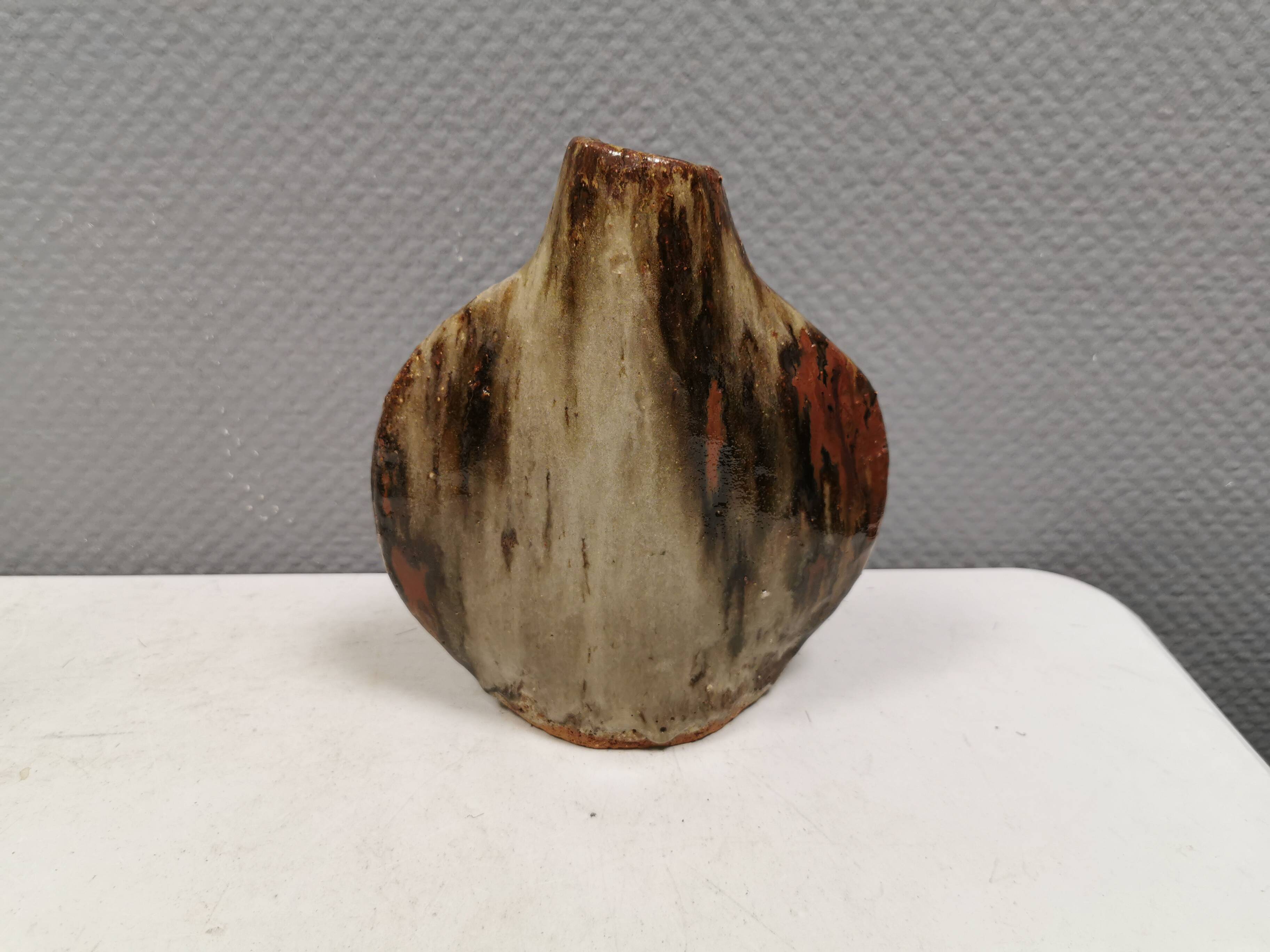 A beautiful Brutalist vase in lovely earth tones. Danish, from the 1980s.