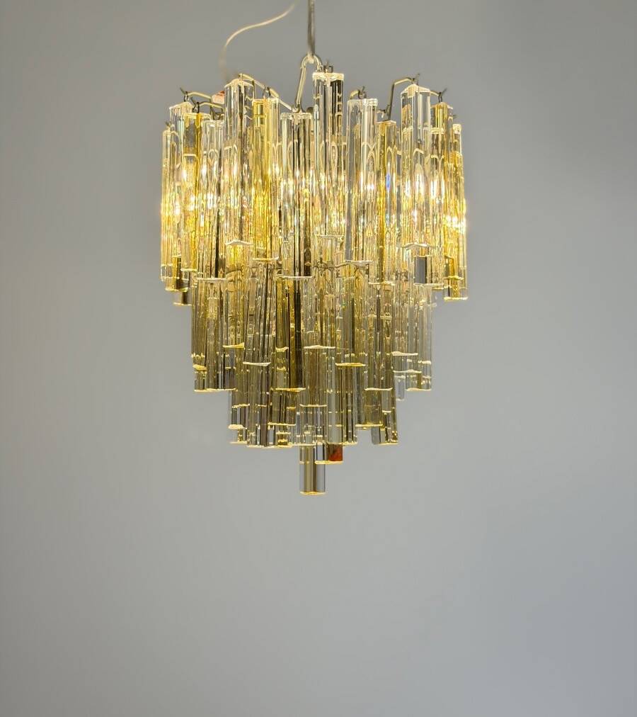 Venetian chandelier in colourless and gold Murano glass, Venini Triedi model, circa 1960.