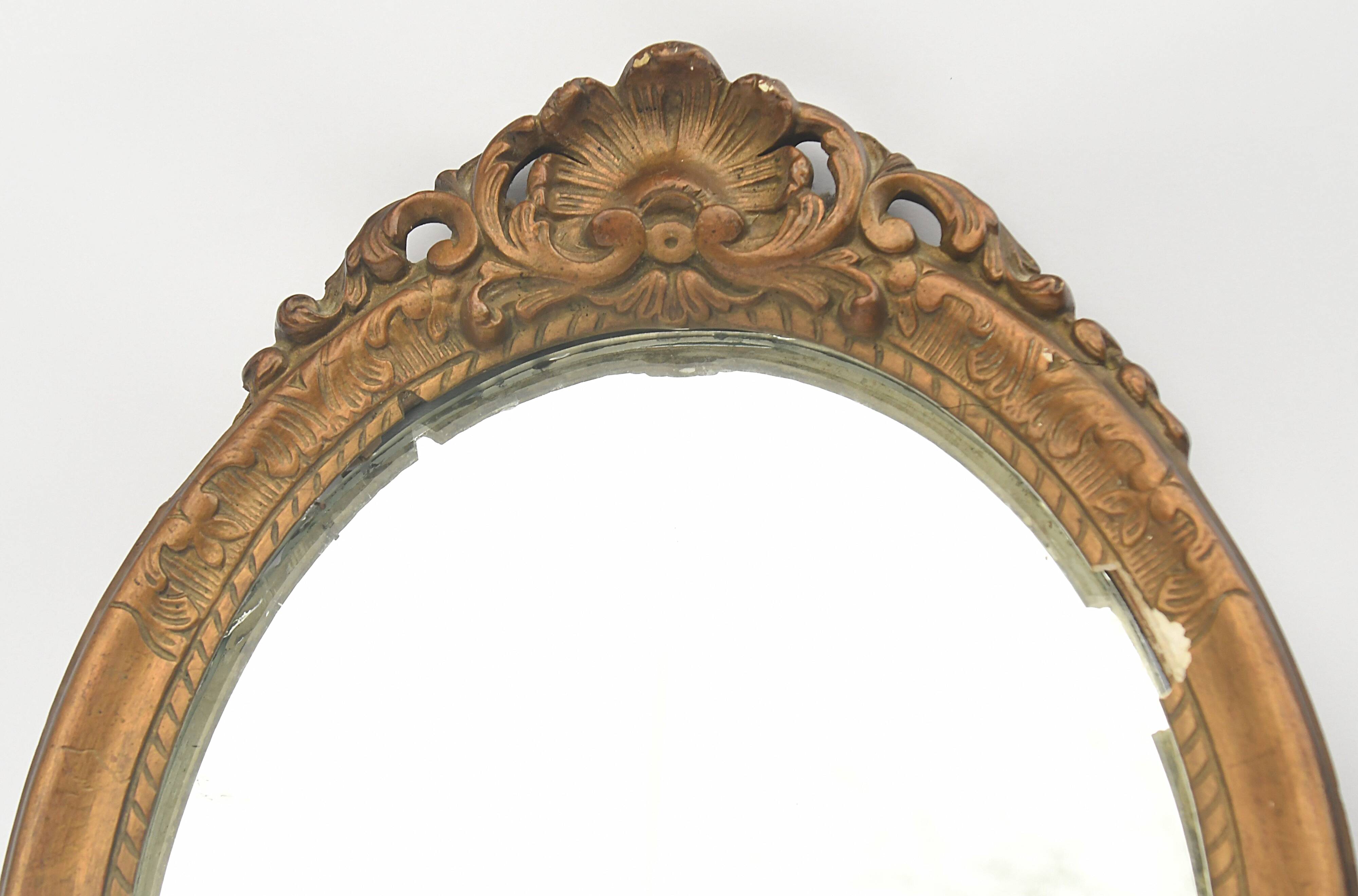 Pair of oval wooden windows with golden patina