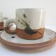 Four pottery cups and saucers from La Colombe Vallauris