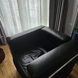 Leather armchair and pouffe