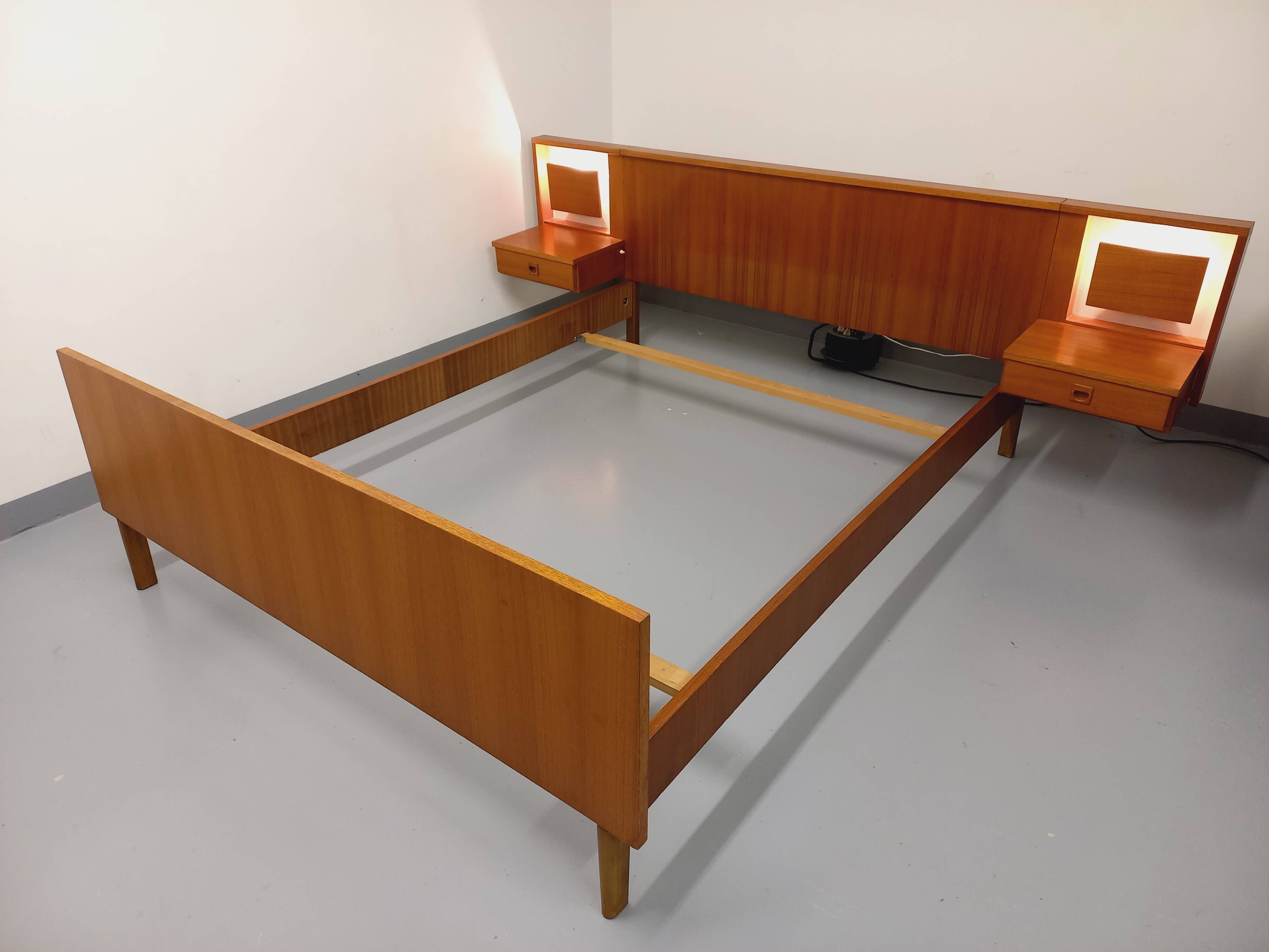 Vintage Scandinavian style double bed in teak from the 60s with integrated bedside lights