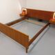 Vintage Scandinavian style double bed in teak from the 60s with integrated bedside lights