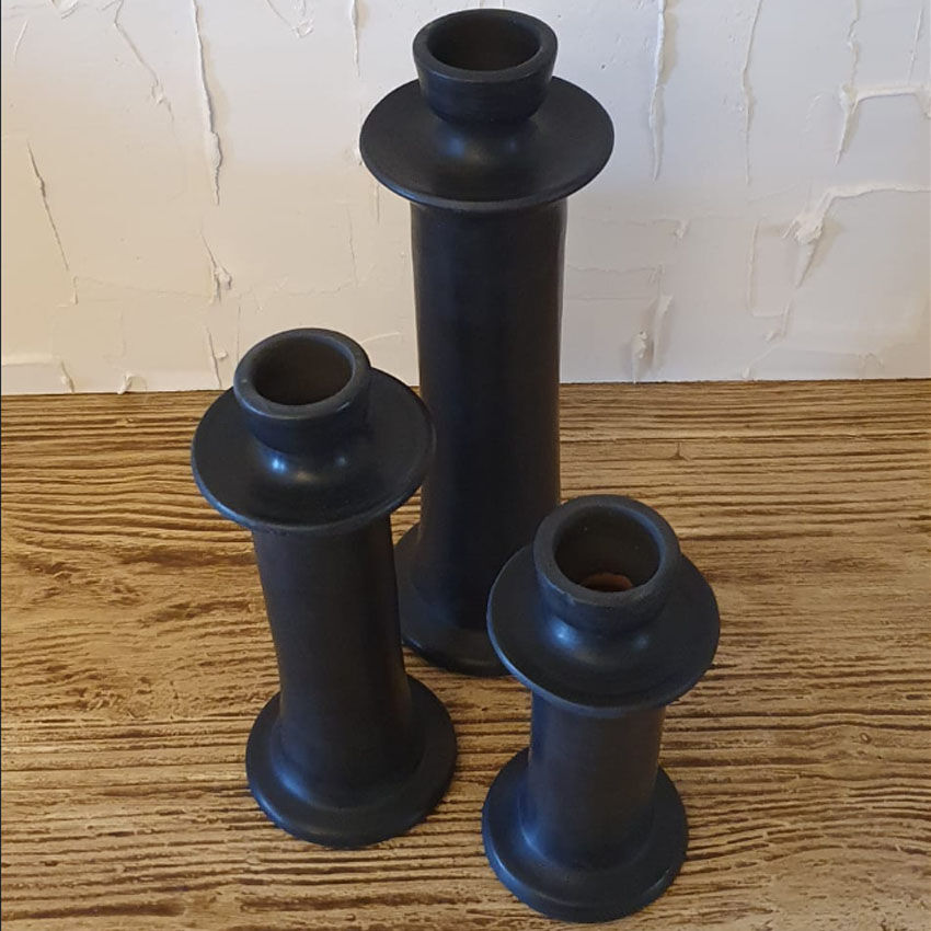 Set of three candlesticks in black tadelakt