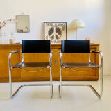 Pair of vintage chrome and black faux leather armchairs